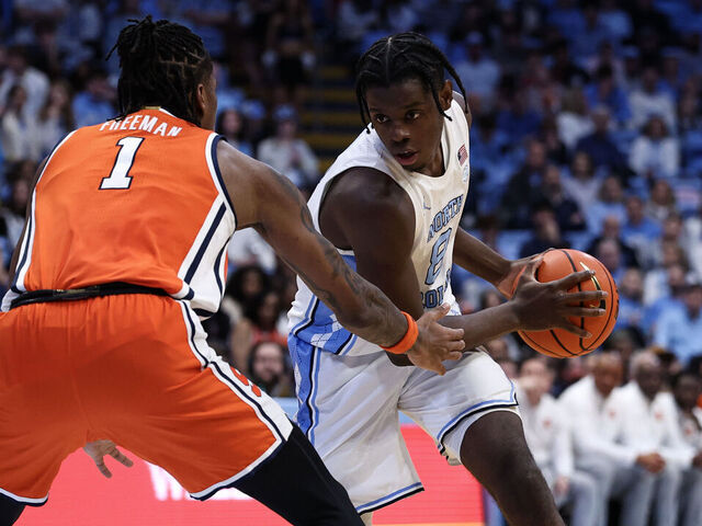 CHAPEL HILL, NORTH CAROLINA - FEBRUARY 02: Caleb Wilson #8 of the North Carolina Tar Heels looks to get past Donnie Freeman #1 of the Syracuse Orange during the second half of a basketball game at Dean E. Smith Center on February 02, 2026 in Chapel Hill, North Carolina.