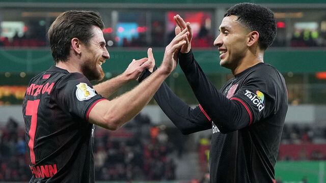 LEVERKUSEN, GERMANY - FEBRUARY 03: Jonas Hofmann of Bayer 04 Leverkusen celebrates scoring his team's third goal with teammate Ezequiel Fernandez during the DFB Cup Quarter Final match between Bayer 04 Leverkusen and FC St. Pauli at BayArena on February 03, 2026 in Leverkusen, Germany.