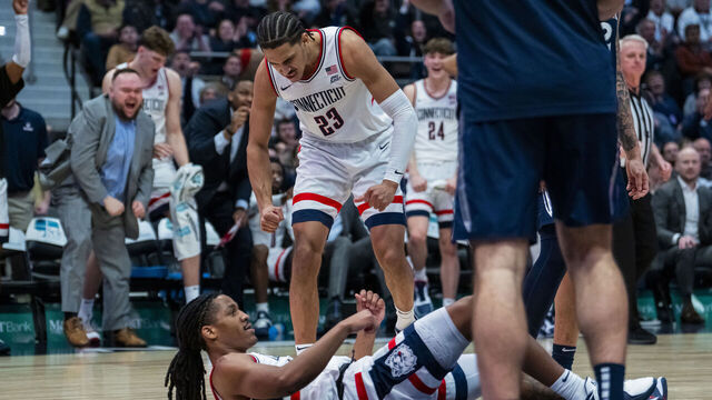 HARTFORD, CONNECTICUT - FEBRUARY 03: Jayden Ross #23 and Silas Demary Jr. #2 of the Connecticut Huskies react during the second half of an NCAA men's basketball game against the Xavier Musketeers at PeoplesBank Arena on February 03, 2026 in Hartford, Connecticut.