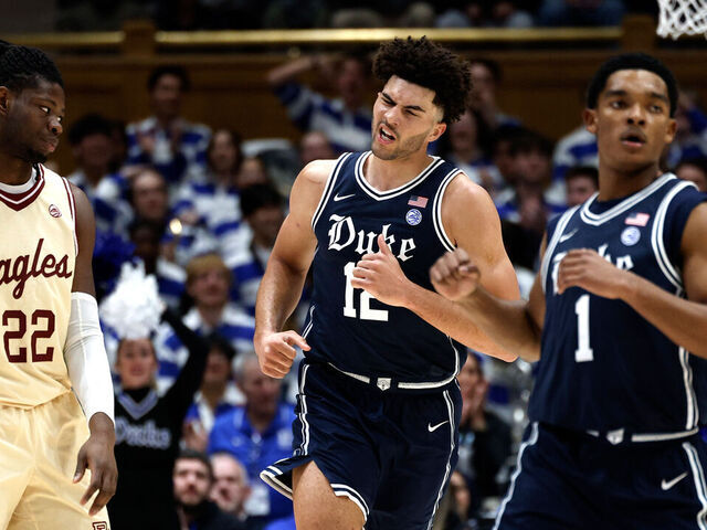 DURHAM, NORTH CAROLINA - FEBRUARY 3: Cameron Boozer #12 of the Duke Blue Devils reacts following a basket as Jayden Hastings #22 of the Boston College Eagles looks on in the first half at Cameron Indoor Stadium on February 3, 2026 in Durham, North Carolina.