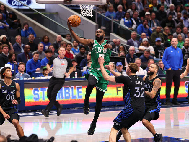 DALLAS, TEXAS - FEBRUARY 03: Jaylen Brown #7 of the Boston Celtics makes a move to the basket against Cooper Flagg #32 of the Dallas Mavericks during the fourth quarter at American Airlines Center on February 03, 2026 in Dallas, Texas.