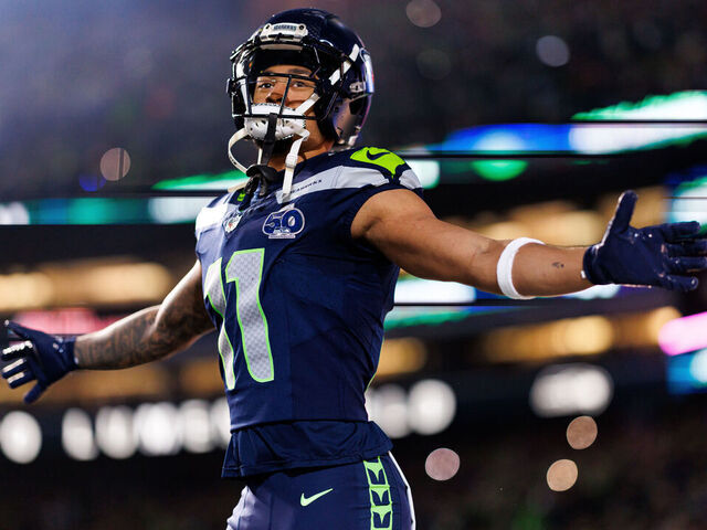 SEATTLE, WASHINGTON - JANUARY 17: Jaxon Smith-Njigba #11 of the Seattle Seahawks enters the field during player introductions prior to an NFL divisional playoff football game against the San Francisco 49ers at Lumen Field on January 17, 2026 in Seattle, Washington.