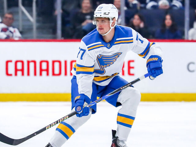 WINNIPEG, CANADA - JANUARY 20: Nick Bjugstad #77 of the St. Louis Blues keeps an eye on the play during first period action against the Winnipeg Jets at the Canada Life Centre on January 20, 2026 in Winnipeg, Manitoba, Canada. The Jets defeated the Blues 3-1.
