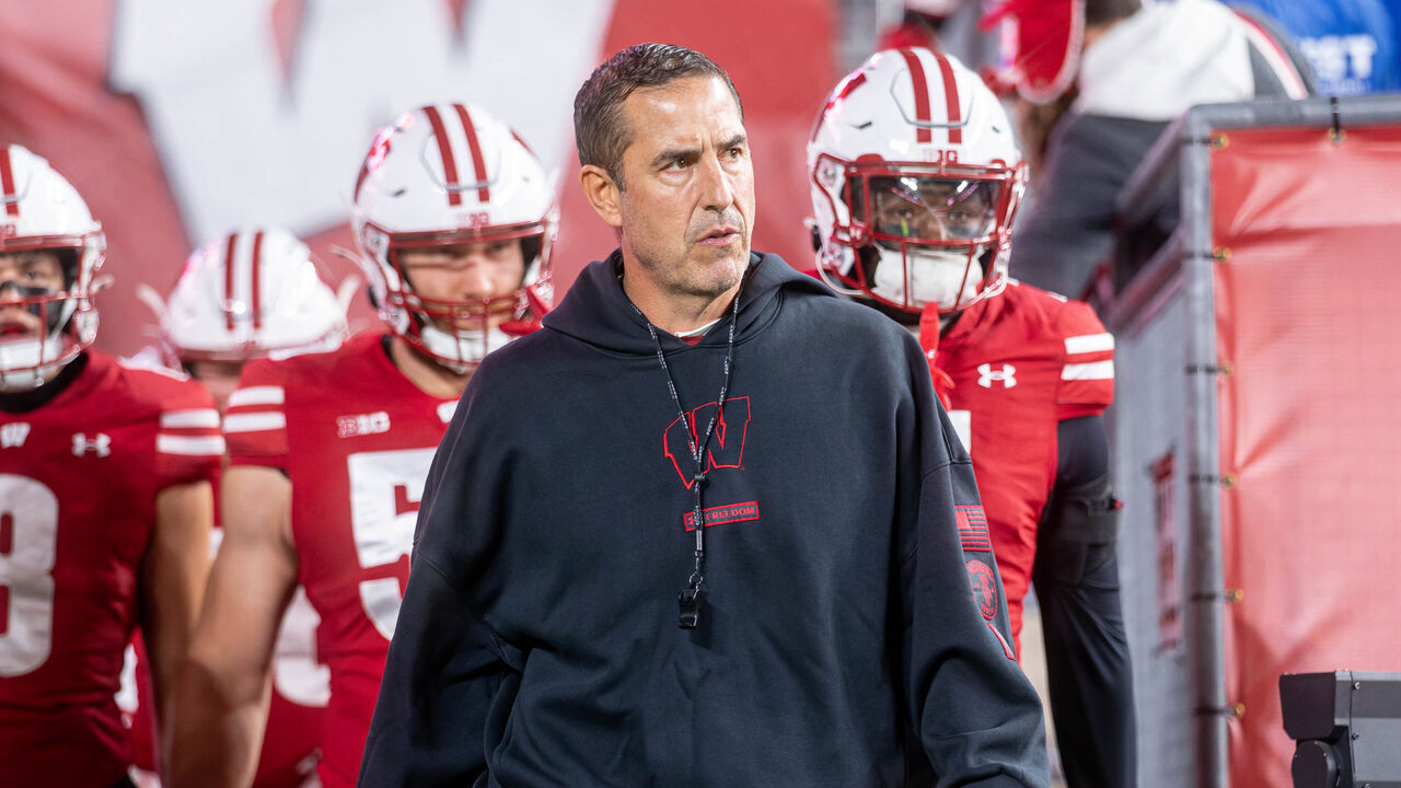 Wisconsin Badgers head coach Luke Fickell leads the Wisconsin Badgers onto the field before playing the Illinois Fighting Illini at Camp Randall Stadium in Madison, Wisconsin, on November 22, 2025.