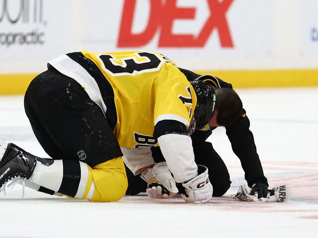 SUNRISE, FLORIDA - FEBRUARY 04: Charlie McAvoy #73 of the Boston Bruins rests on the ice following an injury in the first period against the Florida Panthers at Amerant Bank Arena on February 04, 2026 in Sunrise, Florida.