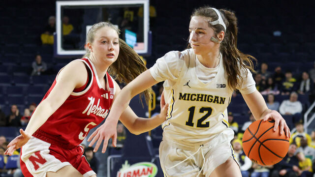 ANN ARBOR, MI - FEBRUARY 04: Michigan Wolverines guard Syla Swords (12) drives to the basket against Nebraska Cornhuskers guard Claire Johnson (5) during the first quarter of a regular season Big Ten Conference college women's basketball game between the Nebraska Cornhuskers and the Michigan Wolverines on February 4, 2026 at Crisler Center in Ann Arbor, Michigan.