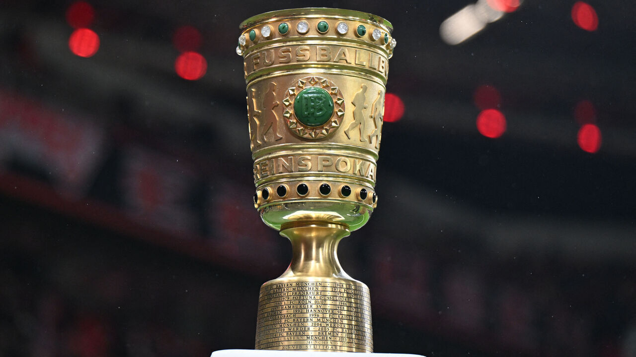 The German Cup trophy is displayed prior to the German Cup (DFB-Pokal) quartefinal football match between Bayer 04 Leverkusen and FC St. Pauli in Leverkusen, western Germany on February 3, 2026. / DFB REGULATIONS PROHIBIT ANY USE OF PHOTOGRAPHS AS IMAGE SEQUENCES AND QUASI-VIDEO.