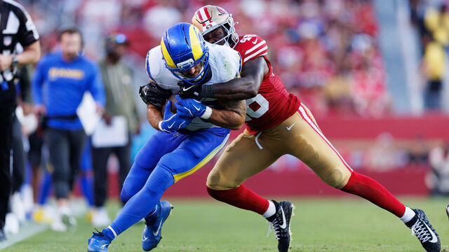 SANTA CLARA, CALIFORNIA - NOVEMBER 9: Tyler Higbee #89 of the Los Angeles Rams is tackled by Tatum Bethune #48 of the San Francisco 49ers after completing a catch during the fourth quarter of an NFL football game at Levi's Stadium on November 09, 2025 in Santa Clara, California.