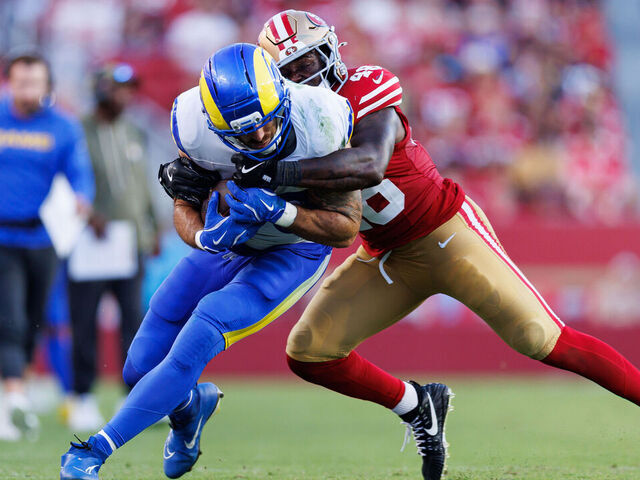SANTA CLARA, CALIFORNIA - NOVEMBER 9: Tyler Higbee #89 of the Los Angeles Rams is tackled by Tatum Bethune #48 of the San Francisco 49ers after completing a catch during the fourth quarter of an NFL football game at Levi's Stadium on November 09, 2025 in Santa Clara, California.