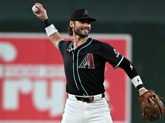PHOENIX, ARIZONA - SEPTEMBER 17: Blaze Alexander #9 of the Arizona Diamondbacks throws the ball against the San Francisco Giants at Chase Field on September 17, 2025 in Phoenix, Arizona.