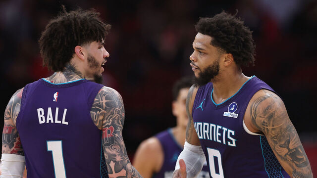 HOUSTON, TEXAS - FEBRUARY 05: Miles Bridges #0 of the Charlotte Hornets celebrates his three-pointer with LaMelo Ball #1 in the first half against the Houston Rockets at Toyota Center on February 05, 2026 in Houston, Texas.