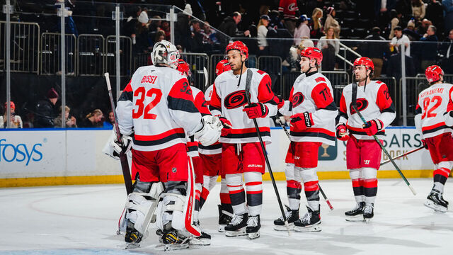NEW YORK, NEW YORK - FEBRUARY 5: Brandon Bussi #32 and K'andre Miller #19 of the Carolina Hurricanes celebrate after the game against the New York Rangers at Madison Square Garden on February 5, 2026 in New York City.