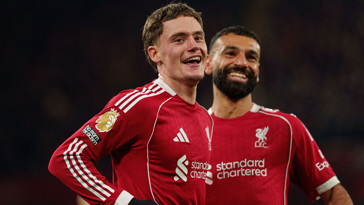 Florian Wirtz celebrates with Mohamed Salah after scoring Liverpool's third goal during the Premier League match between Liverpool and Newcastle United at Anfield in Liverpool, England, on January 31, 2026.