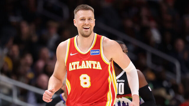 ATLANTA, GEORGIA - DECEMBER 05: Kristaps Porzingis #8 of the Atlanta Hawks reacts after hitting a three-point basket against Tim Hardaway Jr. #10 of the Denver Nuggets during the third quarter at State Farm Arena on December 05, 2025 in Atlanta, Georgia.