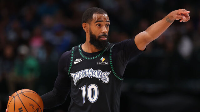 DALLAS, TEXAS - JANUARY 28: Mike Conley #10 of the Minnesota Timberwolves controls the ball during the second half against the Dallas Mavericks at American Airlines Center on January 28, 2026 in Dallas, Texas.