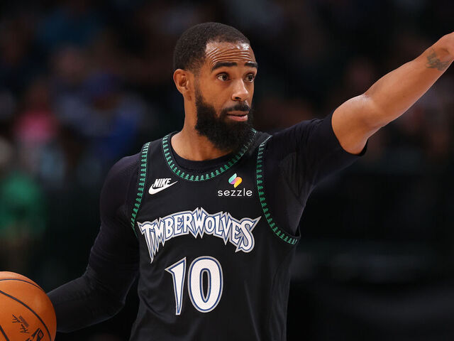 DALLAS, TEXAS - JANUARY 28: Mike Conley #10 of the Minnesota Timberwolves controls the ball during the second half against the Dallas Mavericks at American Airlines Center on January 28, 2026 in Dallas, Texas.