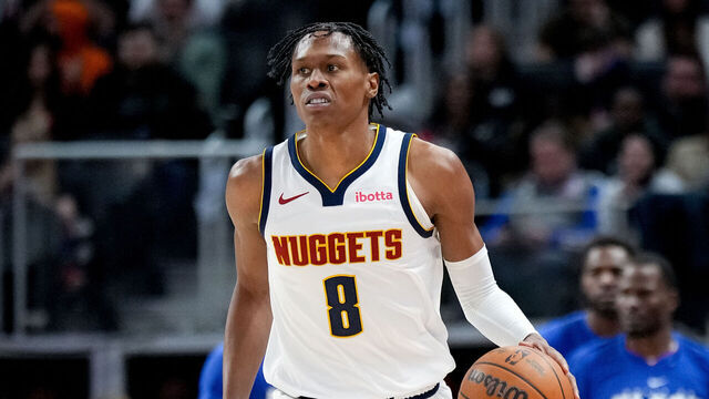 DETROIT, MICHIGAN - FEBRUARY 03: Peyton Watson #8 of the Denver Nuggets dribbles the ball against the Detroit Pistons at Little Caesars Arena on February 03, 2026 in Detroit, Michigan.