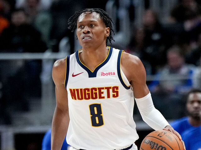 DETROIT, MICHIGAN - FEBRUARY 03: Peyton Watson #8 of the Denver Nuggets dribbles the ball against the Detroit Pistons at Little Caesars Arena on February 03, 2026 in Detroit, Michigan.