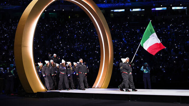 MILAN, ITALY - FEBRUARY 06: Flagbearers Arianna Fontana and Federico Pellegrino of Team Italy enter with the team into the stadium during the opening ceremony of the Milano Cortina 2026 Winter Olympics at San Siro Stadium on February 06, 2026 in Milan, Italy.