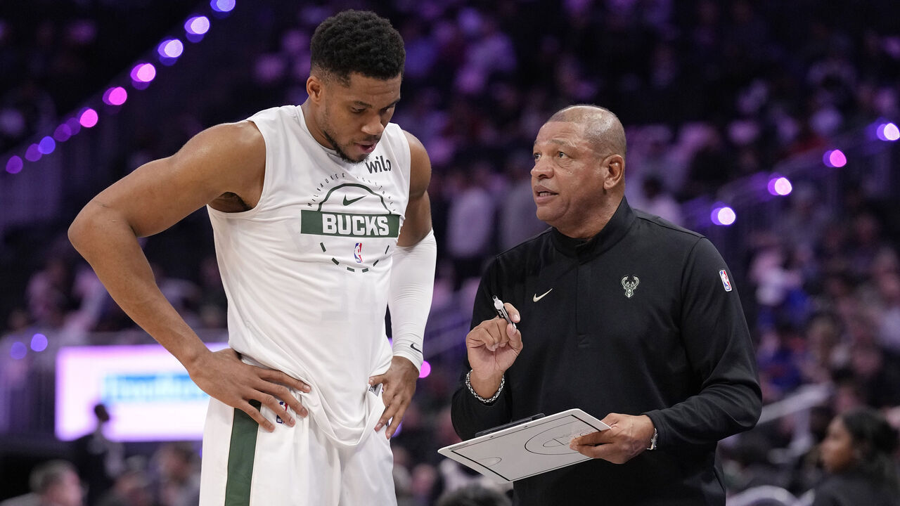 MILWAUKEE, WISCONSIN - OCTOBER 28: Giannis Antetokounmpo #34 and head coach Doc Rivers of the Milwaukee Bucks talk before the start of the third quarter against the New York Knicks at Fiserv Forum on October 28, 2025 in Milwaukee, Wisconsin.