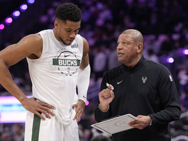 MILWAUKEE, WISCONSIN - OCTOBER 28: Giannis Antetokounmpo #34 and head coach Doc Rivers of the Milwaukee Bucks talk before the start of the third quarter against the New York Knicks at Fiserv Forum on October 28, 2025 in Milwaukee, Wisconsin.