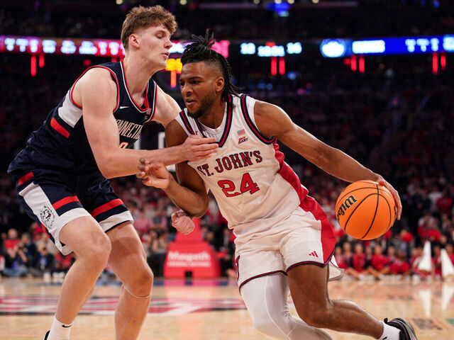 NEW YORK, NEW YORK - FEBRUARY 06: Zuby Ejiofor #24 of the St. John's Red Storm drives to the basket as Eric Reibe #12 of the Connecticut Huskies defends in the first half at Madison Square Garden on February 06, 2026 in New York City.