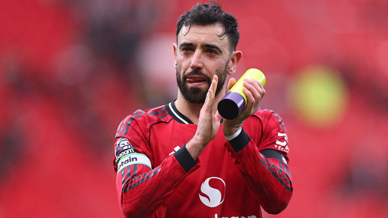 MANCHESTER, ENGLAND - FEBRUARY 7: Bruno Fernandes of Manchester United walks off at full time with his player of the match trophy during the Premier League match between Manchester United and Tottenham Hotspur at Old Trafford on February 7, 2026 in Manchester, United Kingdom.