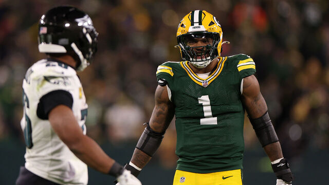 GREEN BAY, WISCONSIN - NOVEMBER 10: Micah Parsons #1 of the Green Bay Packers talks with Saquon Barkley #26 of the Philadelphia Eagles during the fourth quarter in the game at Lambeau Field on November 10, 2025 in Green Bay, Wisconsin.