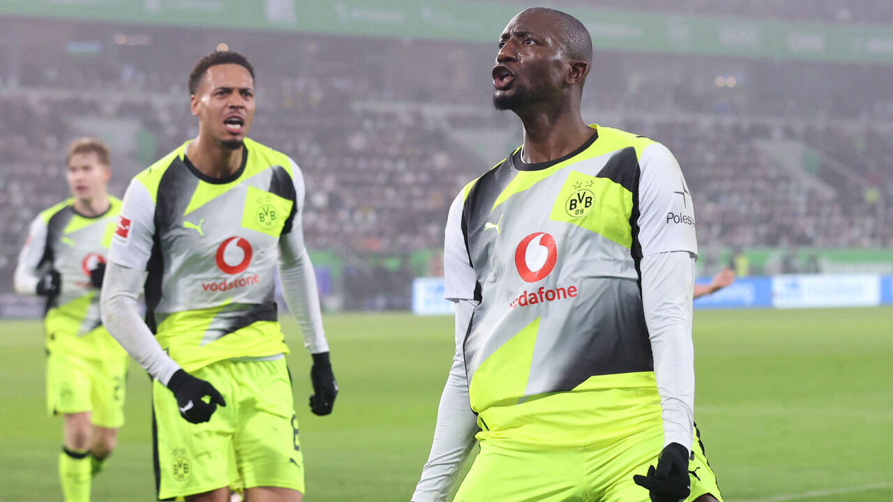 Dortmund's Guinean forward #09 Serhou Guirassy (R) celebrates scoring with Dortmund's German midfielder #08 Felix Nmecha his team's second goal during the German first division Bundesliga football match between VfL Wolfsburg and Borussia Dortmund in Wolfsburg, on February 7, 2026. / DFL REGULATIONS PROHIBIT ANY USE OF PHOTOGRAPHS AS IMAGE SEQUENCES AND/OR QUASI-VIDEO