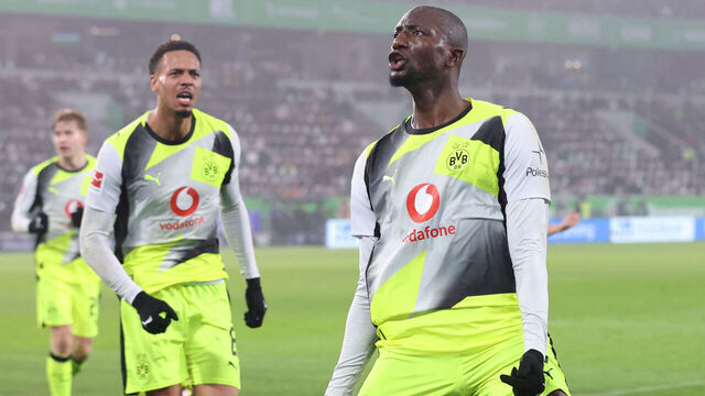 Dortmund's Guinean forward #09 Serhou Guirassy (R) celebrates scoring with Dortmund's German midfielder #08 Felix Nmecha his team's second goal during the German first division Bundesliga football match between VfL Wolfsburg and Borussia Dortmund in Wolfsburg, on February 7, 2026. / DFL REGULATIONS PROHIBIT ANY USE OF PHOTOGRAPHS AS IMAGE SEQUENCES AND/OR QUASI-VIDEO
