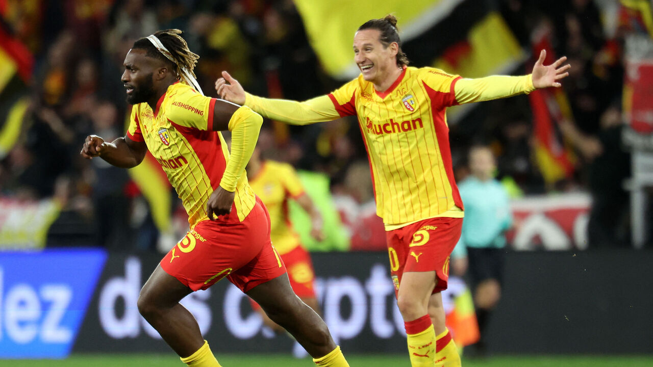 Lens' French forward Allan Saint-Maximin (L) celebrates after scoring his team's third goal during the French L1 football match between RC Lens and Stade Rennais FC at the Stade Bollaert-Delelis in Lens, northern France on February 7, 2026.