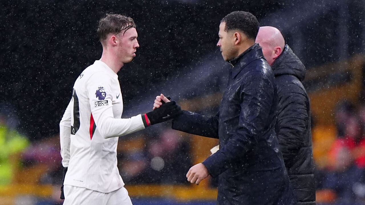 Chelsea's Cole Palmer shakes hands with manager Liam Rosenior after being subbed during the Premier League match at Molineux Stadium, Wolverhampton. Picture date: Saturday February 7, 2026.