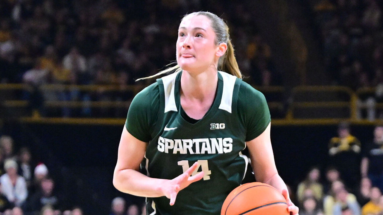 IOWA CITY, IA - JANUARY 18: Michigan State forward Grace VanSlooten (14) drives to the basket as Iowa forward Hannah Stuelke (45) defends during a Big Ten Conference women's basketball game between the Michigan State Spartans and the Iowa Hawkeyes, on Jan. 18, 2026, at Carver-Hawkeye Arena in Iowa City, IA.