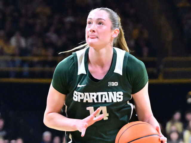 IOWA CITY, IA - JANUARY 18: Michigan State forward Grace VanSlooten (14) drives to the basket as Iowa forward Hannah Stuelke (45) defends during a Big Ten Conference women's basketball game between the Michigan State Spartans and the Iowa Hawkeyes, on Jan. 18, 2026, at Carver-Hawkeye Arena in Iowa City, IA.
