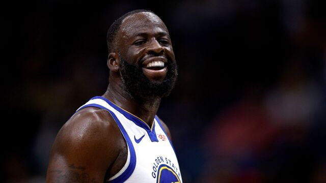 NEW ORLEANS, LOUISIANA - NOVEMBER 16: Draymond Green #23 of the Golden State Warriors interacts with a fan during the first quarter of an NBA game against the New Orleans Pelicans at Smoothie King Center on November 16, 2025 in New Orleans, Louisiana.