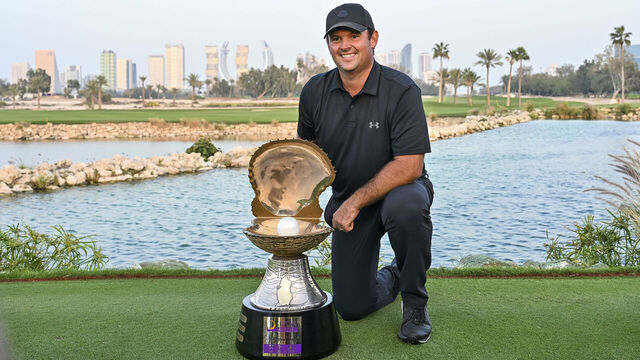 Patrick Reed of the United States celebrates with the trophy following his victory on day four of the Qatar Masters 2026 golf tournament at the Doha Golf Club in Doha, Qatar, on February 8, 2026.