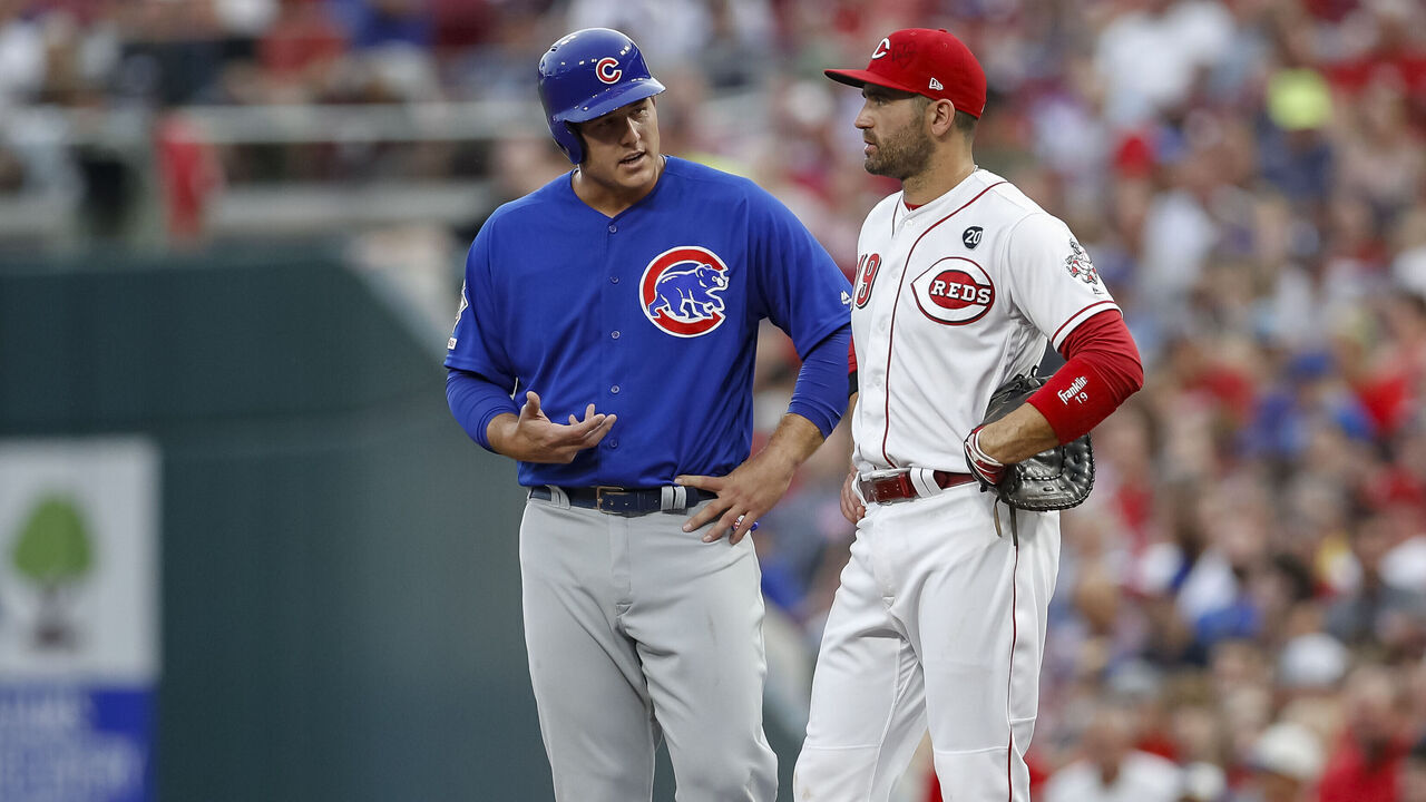 CINCINNATI, OH - AUGUST 08: Anthony Rizzo #44 of the Chicago Cubs talks with Joey Votto #19 of the Cincinnati Reds during the game at Great American Ball Park on August 8, 2019 in Cincinnati, Ohio.