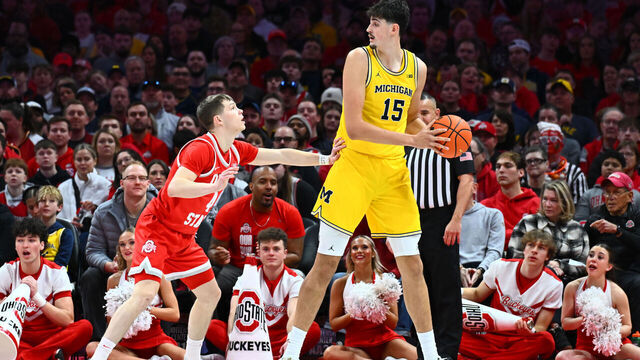 COLUMBUS, OHIO - FEBRUARY 8: Aday Mara #15 of the Michigan Wolverines controls the ball as Gabe Cupps #4 of the Ohio State Buckeyes defends in the first half of a game at Value City Arena on February 8, 2026 in Columbus, Ohio.