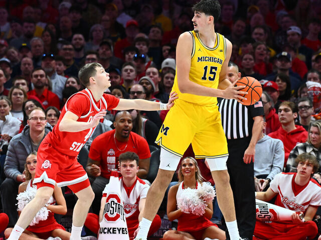 COLUMBUS, OHIO - FEBRUARY 8: Aday Mara #15 of the Michigan Wolverines controls the ball as Gabe Cupps #4 of the Ohio State Buckeyes defends in the first half of a game at Value City Arena on February 8, 2026 in Columbus, Ohio.