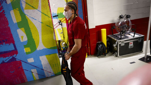 New England Patriots' Mack Hollins walks through Levi's Stadium with a prisoner outfit and barefoot before Super Bowl LX between the Seattle Seahawks and New England Patriots in Santa Clara, Calif. on Sunday, Feb. 8, 2026.