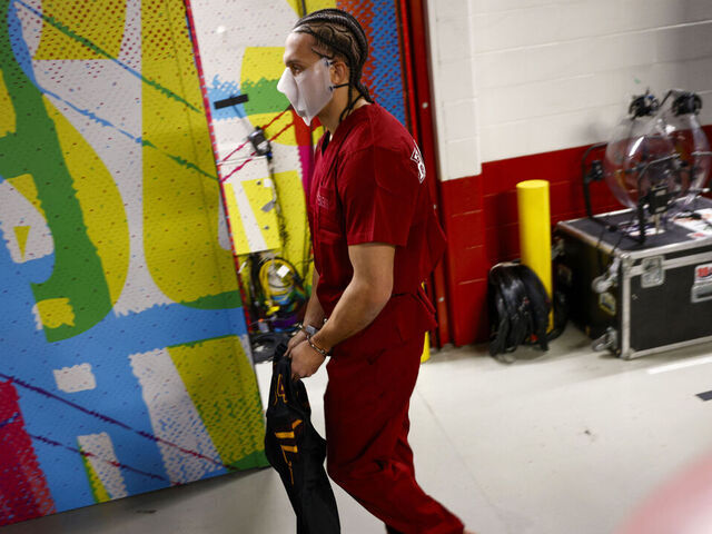 New England Patriots' Mack Hollins walks through Levi's Stadium with a prisoner outfit and barefoot before Super Bowl LX between the Seattle Seahawks and New England Patriots in Santa Clara, Calif. on Sunday, Feb. 8, 2026.