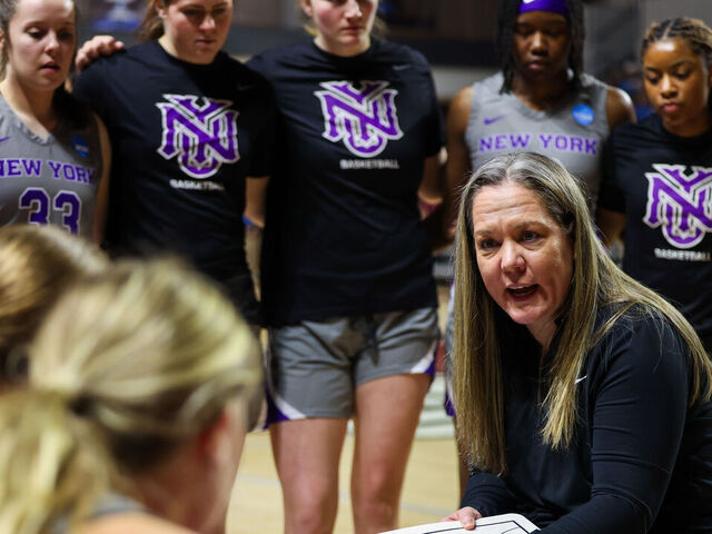 SALEM, VIRGINIA - MARCH 22: Head coach Meg Barber of the NYU Violets instructs her team in the second half during the Division III Women's Basketball Championship held at the Cregger Center on March 22, 2025 in Salem, Virginia.