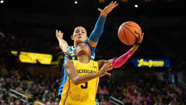 ANN ARBOR, MICHIGAN - FEBRUARY 8: Mila Holloway #3 of the Michigan Wolverines goes to the basket against Lauren Betts #51 of the UCLA Bruins during the second quarter at Crisler Arena on February 8, 2026 in Ann Arbor, Michigan.