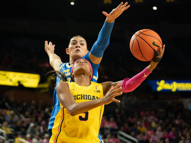 ANN ARBOR, MICHIGAN - FEBRUARY 8: Mila Holloway #3 of the Michigan Wolverines goes to the basket against Lauren Betts #51 of the UCLA Bruins during the second quarter at Crisler Arena on February 8, 2026 in Ann Arbor, Michigan.