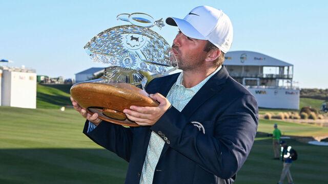 SCOTTSDALE, AZ - FEBRUARY 08: Chris Gotterup (USA) holds the trophy for winning the Waste Management Phoenix Open on February 8, 2026, at TPC Scottsdale, Scottsdale, Arizona.