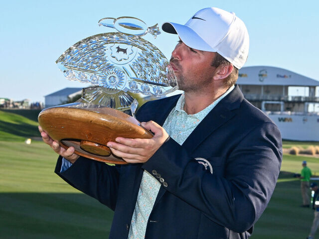 SCOTTSDALE, AZ - FEBRUARY 08: Chris Gotterup (USA) holds the trophy for winning the Waste Management Phoenix Open on February 8, 2026, at TPC Scottsdale, Scottsdale, Arizona.