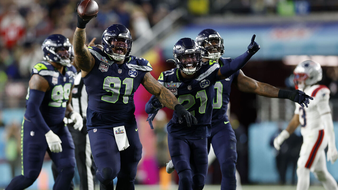 Seattle Seahawks Byron Murphy II (91), Devon Witherspoon (21), and the Seahawks defense celebrate after Murphy recovered a fumble after a sack during the third quarter of Super Bowl LX between the Seattle Seahawks and New England Patriots in Santa Clara, Calif. on Sunday, Feb. 8, 2026.