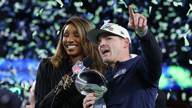 SANTA CLARA, CALIFORNIA - FEBRUARY 08: Head coach Mike MacDonald of the Seattle Seahawks celebrates with the Vince Lombardi Trophy after defeating the New England Patriots 29-13 to win Super Bowl LX at Levi's Stadium on February 08, 2026 in Santa Clara, California.
