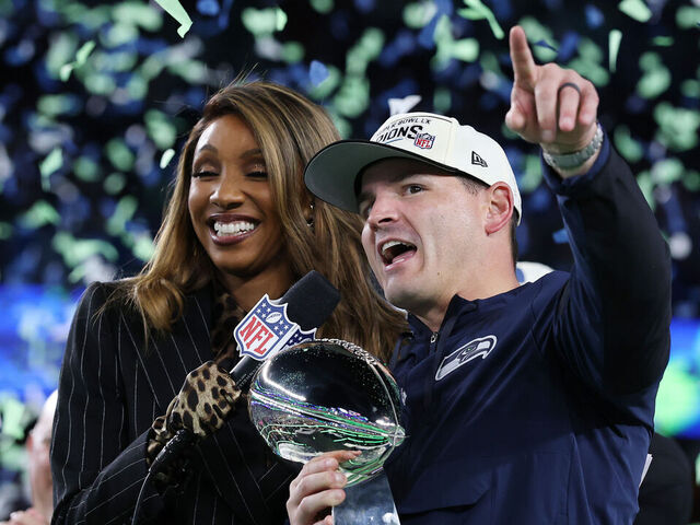SANTA CLARA, CALIFORNIA - FEBRUARY 08: Head coach Mike MacDonald of the Seattle Seahawks celebrates with the Vince Lombardi Trophy after defeating the New England Patriots 29-13 to win Super Bowl LX at Levi's Stadium on February 08, 2026 in Santa Clara, California.