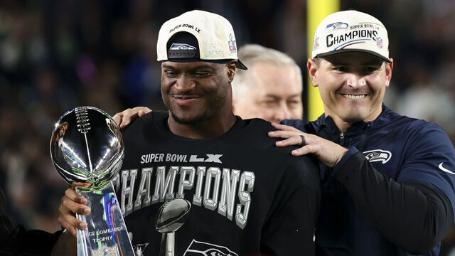 SANTA CLARA, CALIFORNIA - FEBRUARY 08: Mike MacDonald of the Seattle Seahawks and Kenneth Walker III #9 of the Seattle Seahawks celebrate with the Vince Lombardi Trophy after defeating the New England Patriots in the Super Bowl LX at Levi's Stadium on February 08, 2026 in Santa Clara, California.